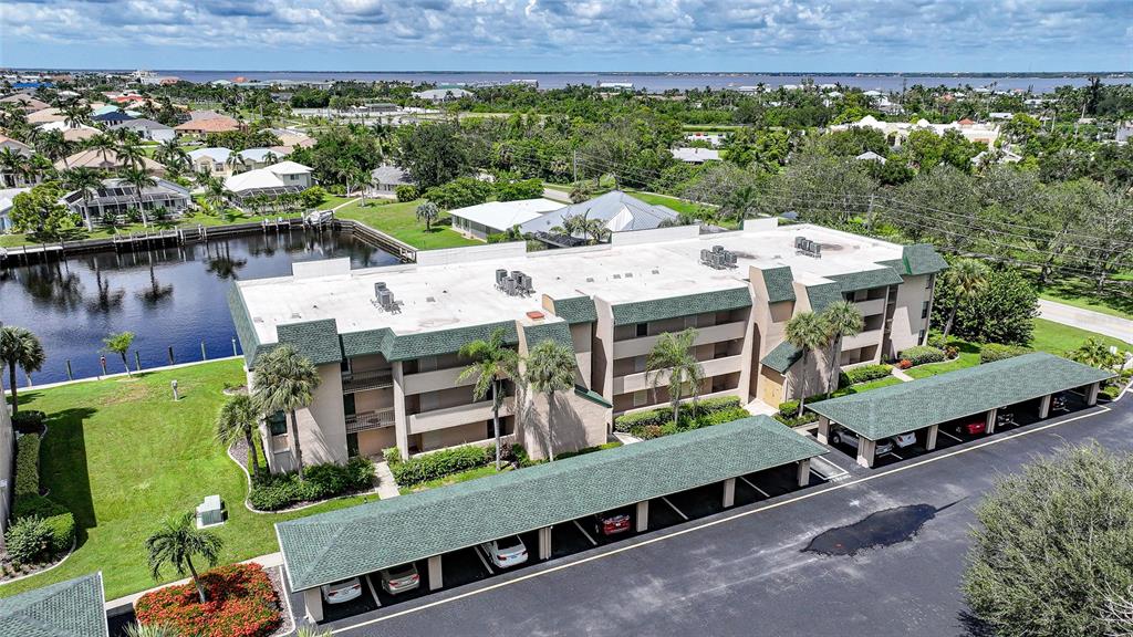 601 Shreve Street, Unit 16A Punta Gorda, FL 33950 - Photo 39 of 52 an aerial view of a large building and a yard