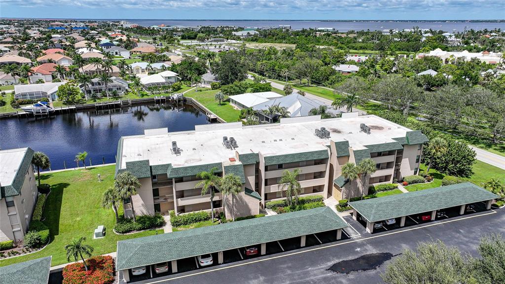 601 Shreve Street, Unit 16A Punta Gorda, FL 33950 - Photo 40 of 52 an aerial view of a house with garden space and outdoor seating