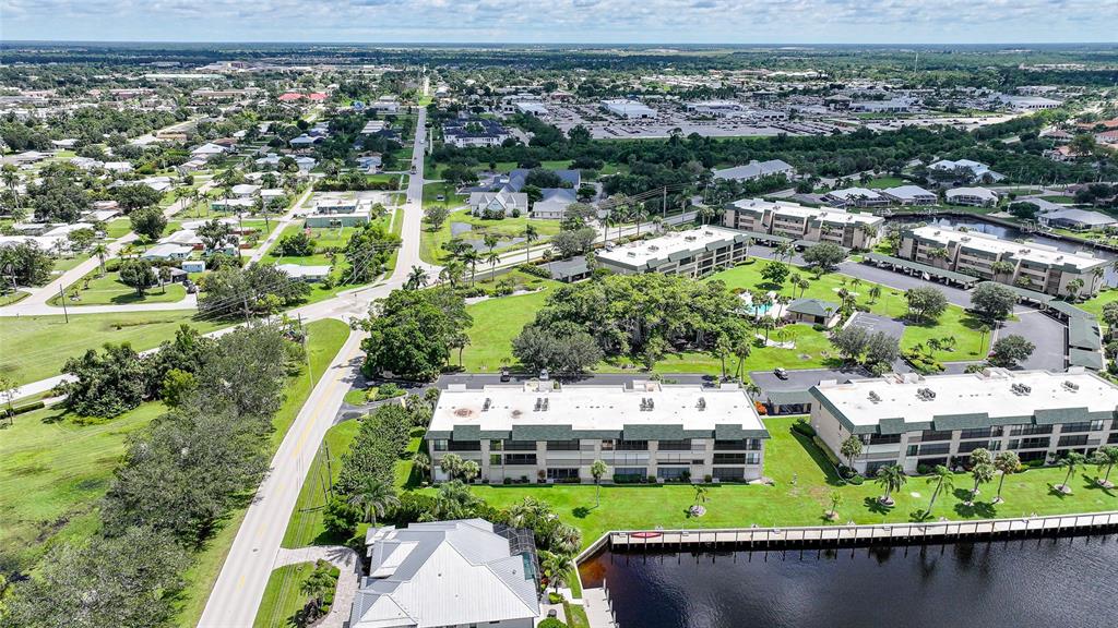 601 Shreve Street, Unit 16A Punta Gorda, FL 33950 - Photo 42 of 52 an aerial view of a house with a garden and lake view