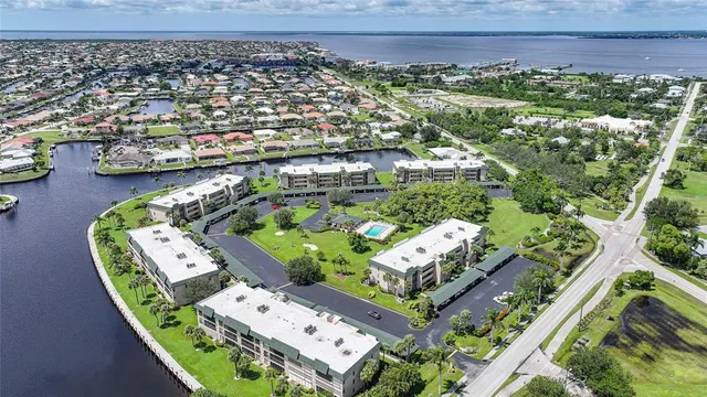 an aerial view of a house with yard swimming pool and outdoor seating