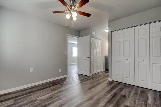 a view of an empty room and wooden floor