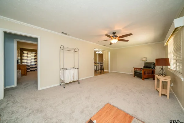 a view of livingroom with furniture and a ceiling fan