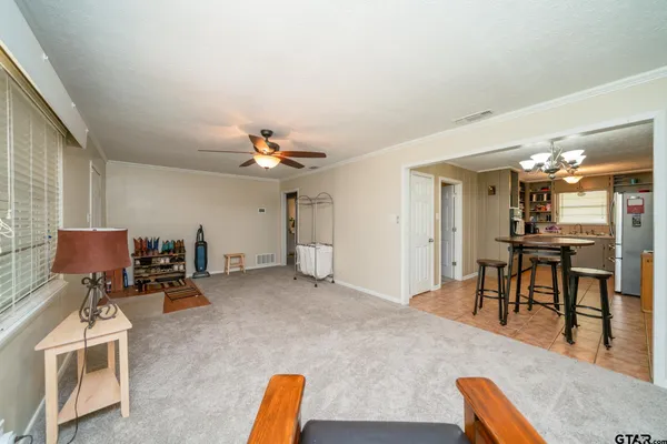 a view of a livingroom with furniture and a table