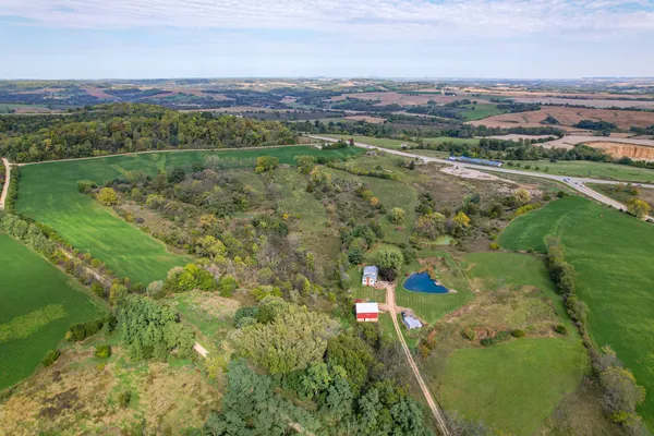 an aerial view of residential houses with outdoor space and river