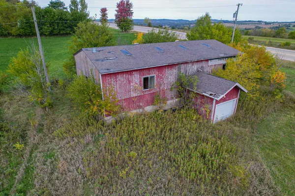 a aerial view of a house with a yard