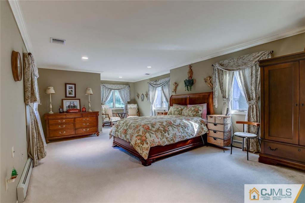 90 Union Valley Road Monroe Township, NJ 08831 - Photo 11 of 25 a bedroom with a bed and a couch