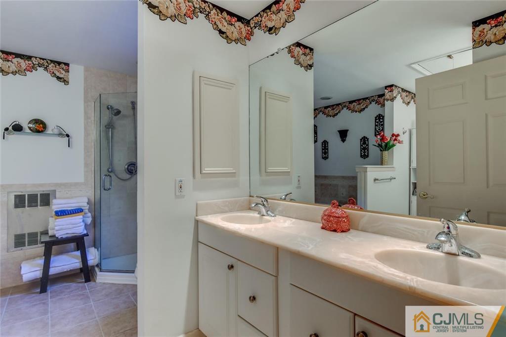 90 Union Valley Road Monroe Township, NJ 08831 - Photo 13 of 25 a bathroom with a sink and a mirror