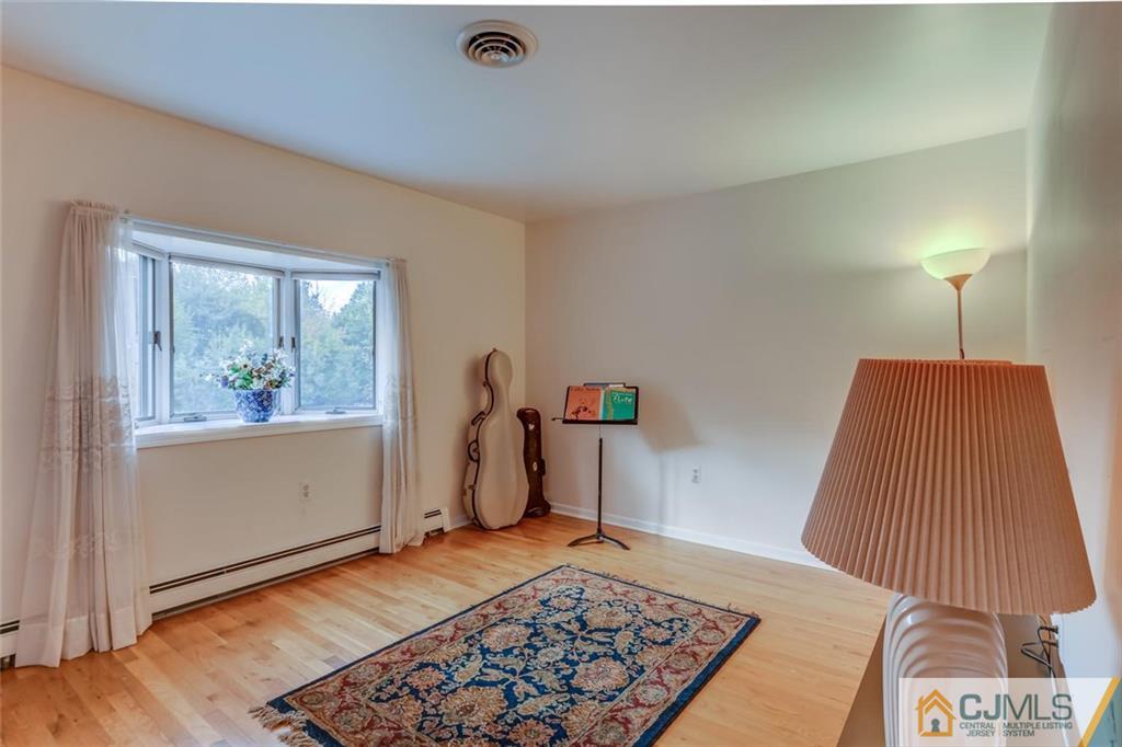 90 Union Valley Road Monroe Township, NJ 08831 - Photo 15 of 25 a bedroom with a bed and a window