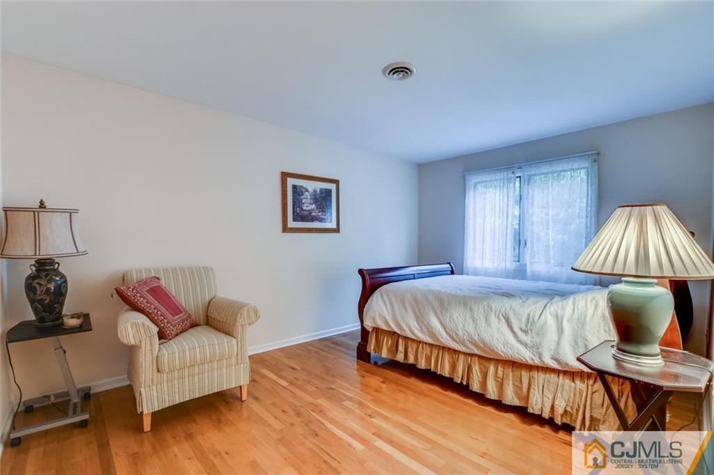 90 Union Valley Road Monroe Township, NJ 08831 - Photo 17 of 25 a bed room with a bed and a couch