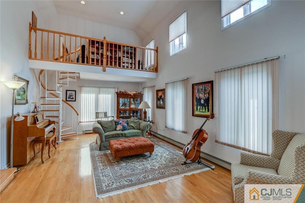 90 Union Valley Road Monroe Township, NJ 08831 - Photo 3 of 25 a living room with furniture gym equipment and a rug