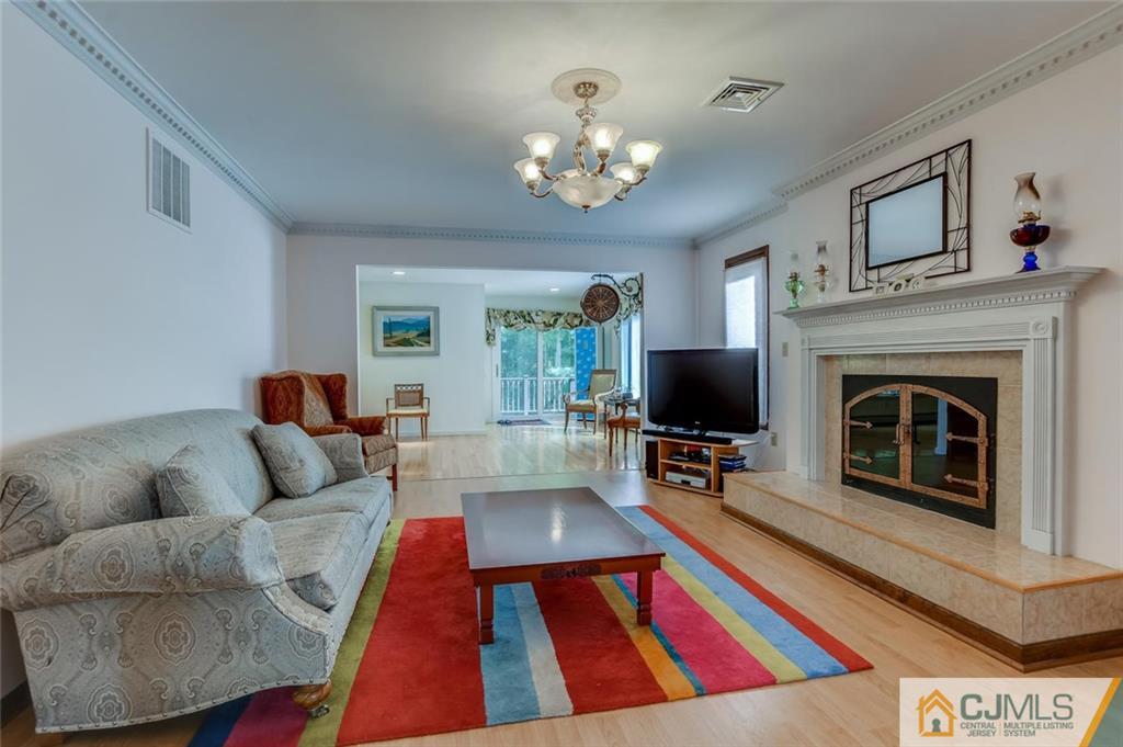 90 Union Valley Road Monroe Township, NJ 08831 - Photo 7 of 25 a living room with furniture and a fireplace