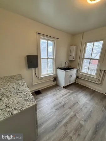 a living room with furniture and windows