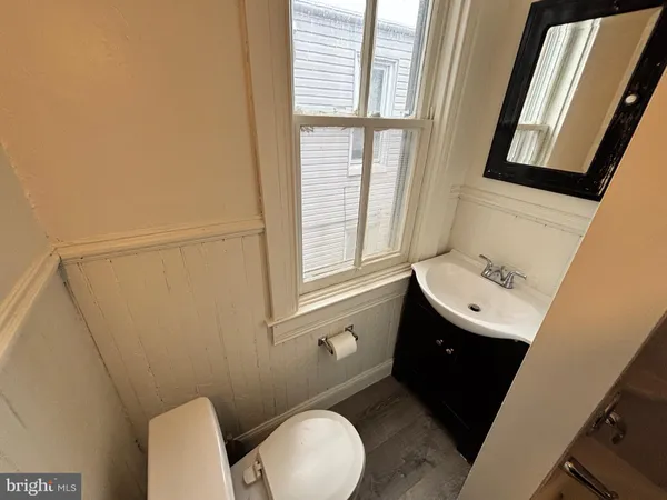 a bathroom with a sink and toilet