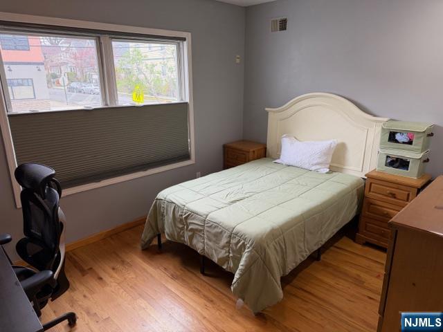 312 Centre Avenue, Unit 1 Secaucus, NJ 07094 - Photo 12 of 17 a bedroom with a bed and window
