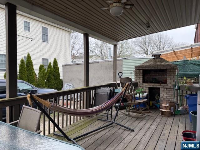 312 Centre Avenue, Unit 1 Secaucus, NJ 07094 - Photo 16 of 17 a view of a balcony with furniture and wooden floor