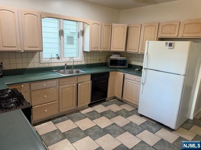 312 Centre Avenue, Unit 1 Secaucus, NJ 07094 - Photo 4 of 17 a kitchen with a sink a stove a refrigerator and cabinets
