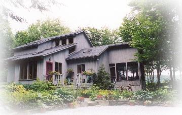14 Hemlock Road Tyringham, MA 01264 - Photo 1 of 2 a front view of a house with garden