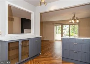 a kitchen with a wooden cabinets and a stove top oven