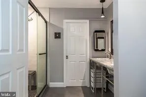 a bathroom with a sink and a mirror