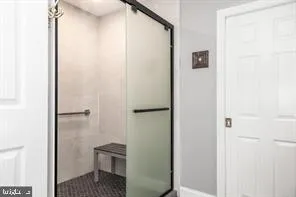 a bathroom with a shower and a toilet