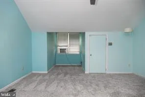 an empty room with closet area