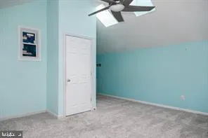 an empty room with a fan
