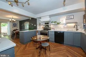 a kitchen with a dining table and chairs
