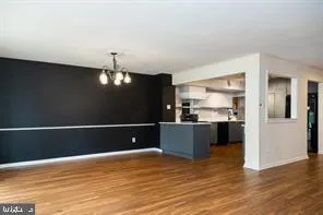 a view of a kitchen with wooden floor