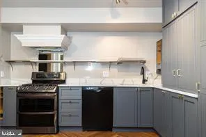 a kitchen with a stove and a sink