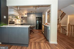 4 Victorian Court Chesterbrook, PA 19087 - Photo 8 of 39 a kitchen with stainless steel appliances granite countertop a refrigerator a sink and wooden floors