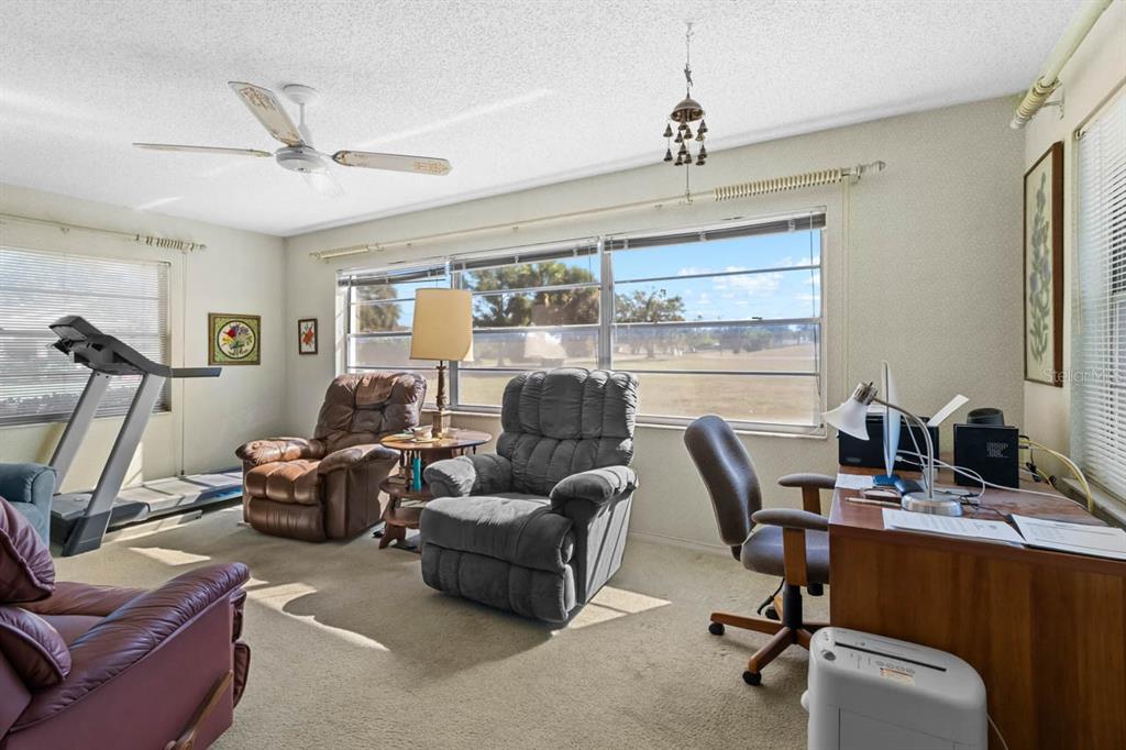 1602 Hovington Circle Sun City Center, FL 33573 - Photo 12 of 47 a view of a livingroom with furniture and a window