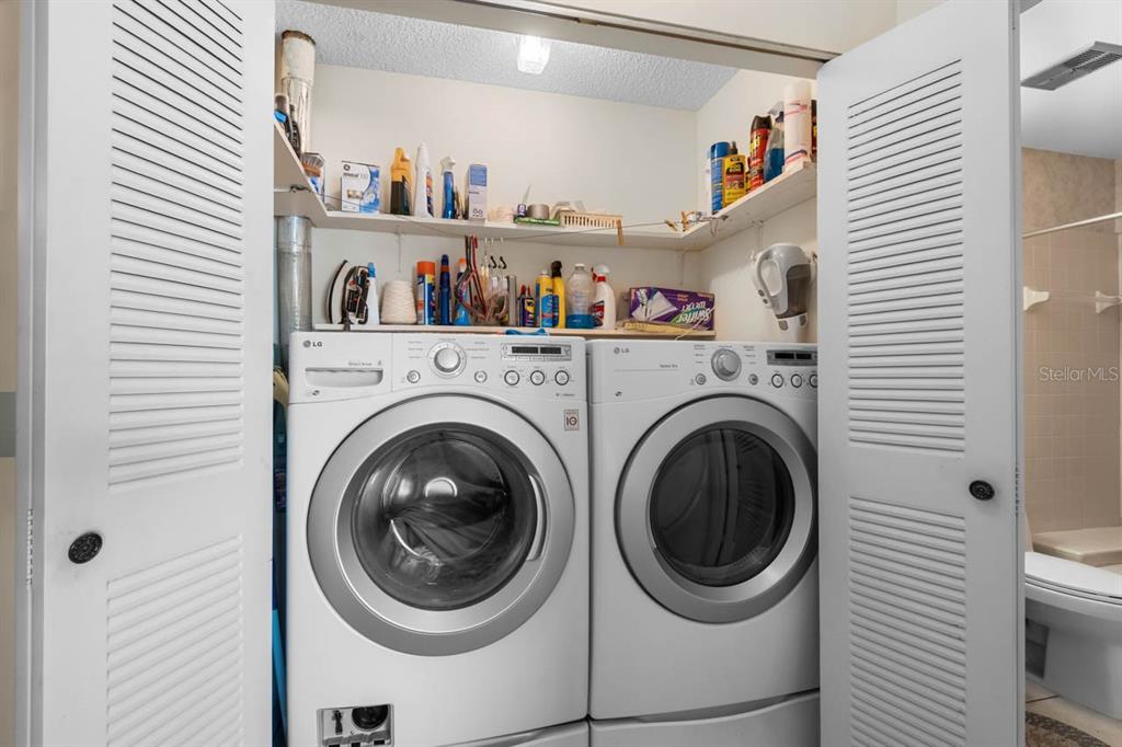 1602 Hovington Circle Sun City Center, FL 33573 - Photo 17 of 47 a utility room with dryer and washer