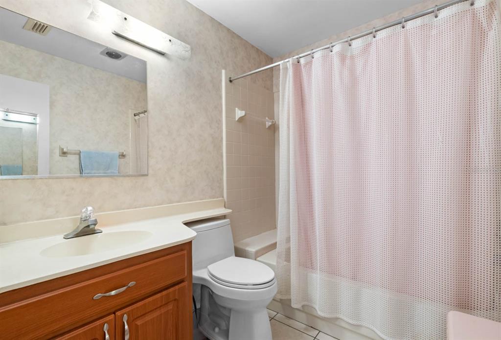 1602 Hovington Circle Sun City Center, FL 33573 - Photo 19 of 47 a bathroom with a sink a toilet and shower