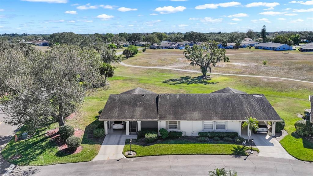 1602 Hovington Circle Sun City Center, FL 33573 - Photo 30 of 47 an aerial view of a house with a yard basket ball court and outdoor seating