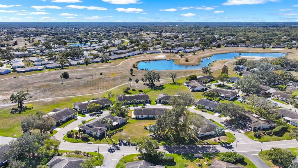 1602 Hovington Circle Sun City Center, FL 33573 - Photo 33 of 47 an aerial view of residential houses with outdoor space