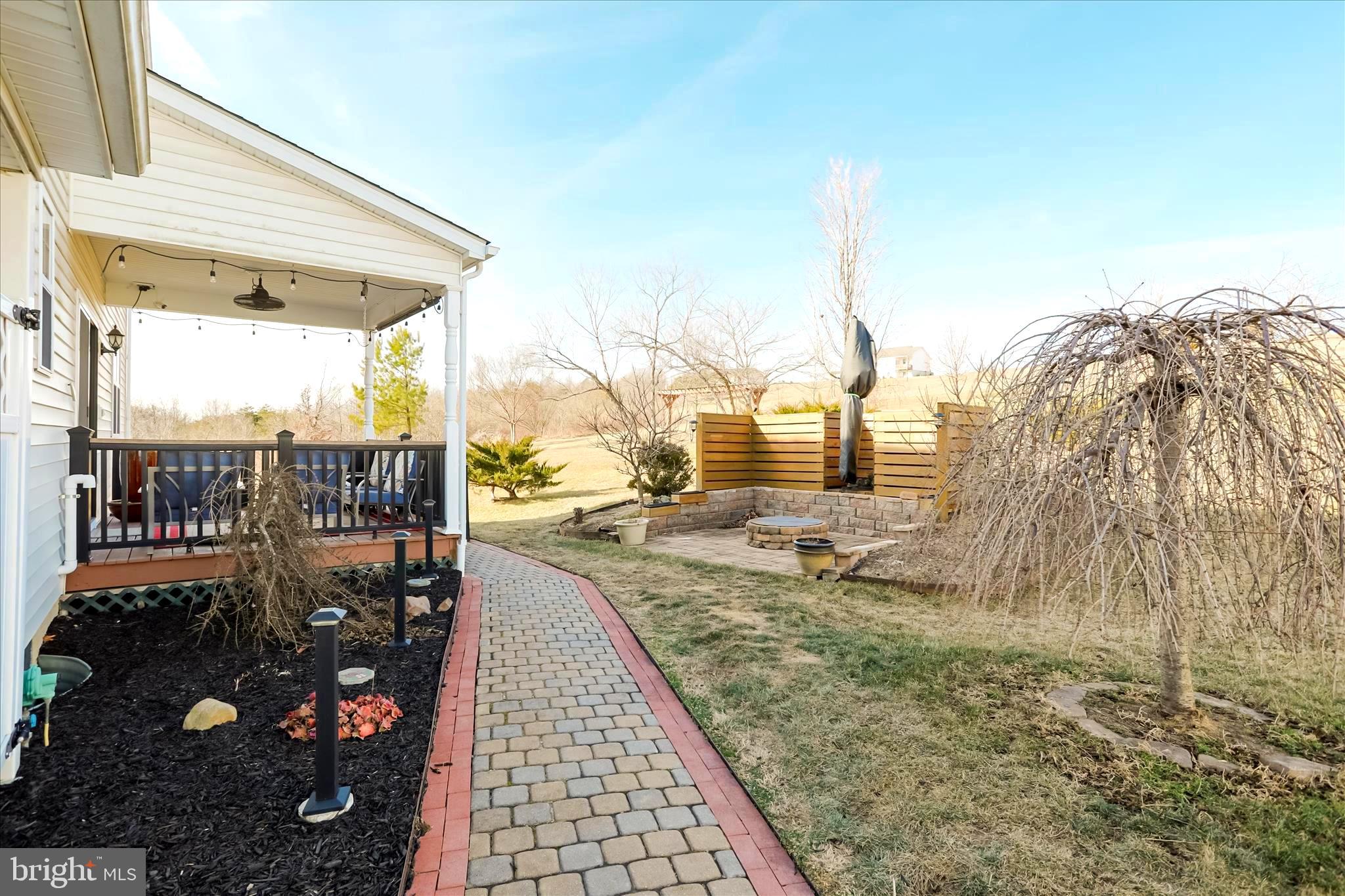 2747 Timber Rdg Road Capon Bridge, WV 26711 - Photo 47 of 97 Brick walkway to back deck and fire pit