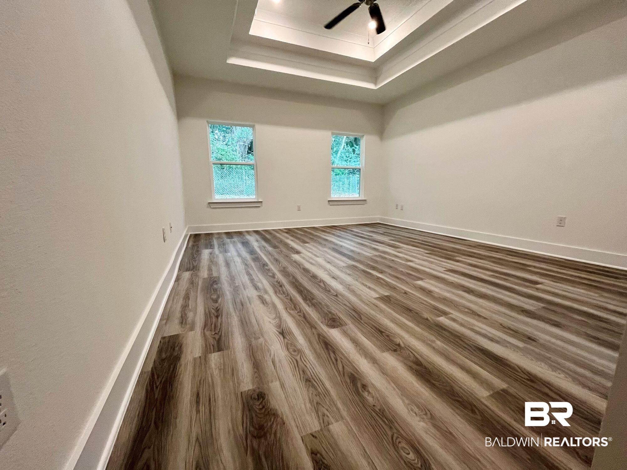 334 Barndling Street Fairhope, AL 36532 - Photo 25 of 34 Spare room with hardwood / wood-style floors, ceiling fan, and a raised ceiling