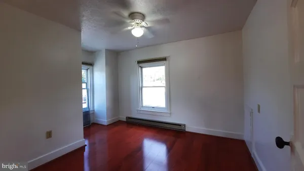 a view of empty room with windows