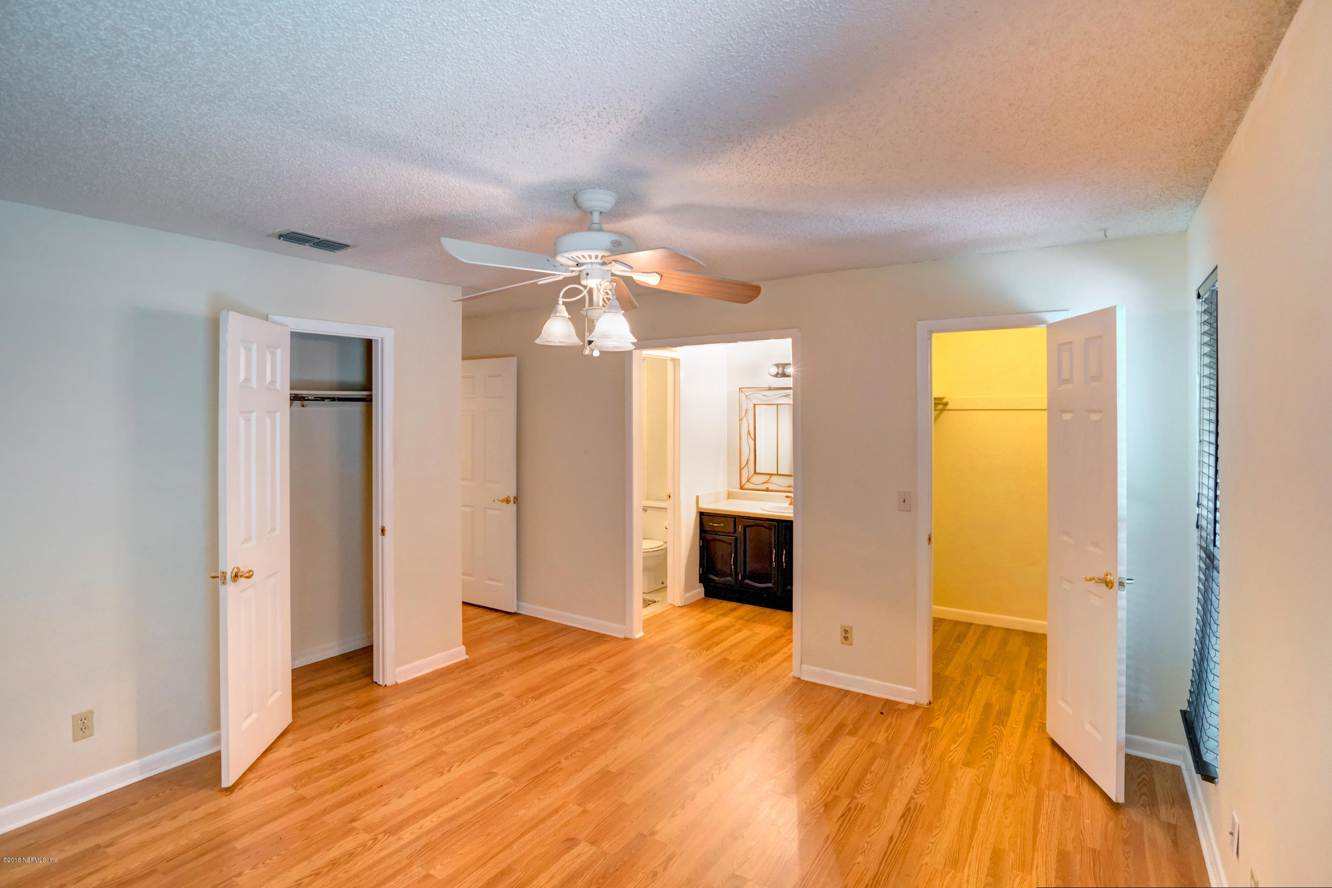 2055 Derringer Road Jacksonville, FL 32225 - Photo 11 of 25 a view of empty room with wooden floor and fan