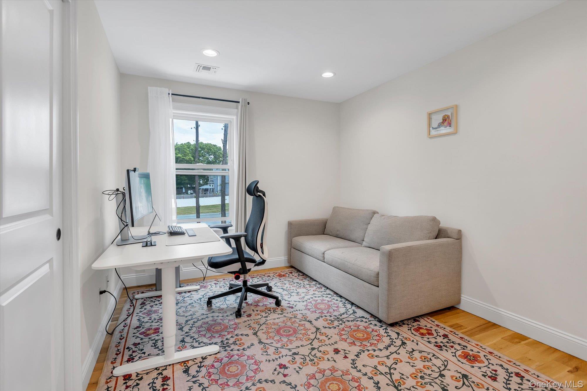 135 Elizabeth Way Ridge, NY 11961 - Photo 14 of 24 a work room with furniture and a window