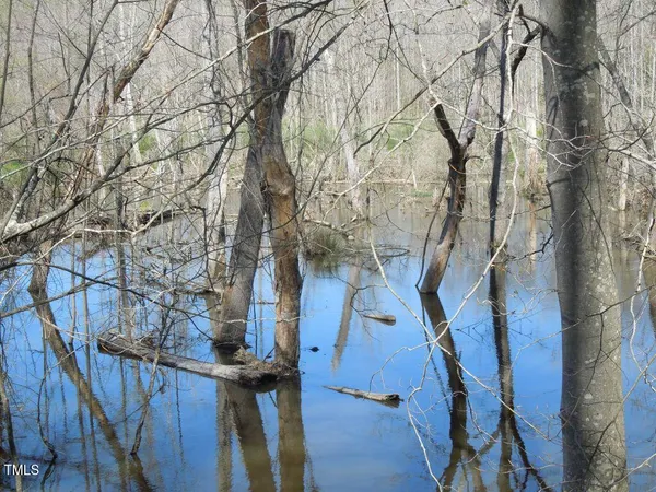 a view of balcony with wooden fence
