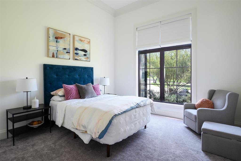 635 Highpoint Road Royse City, TX 75189 - Photo 23 of 35 a bedroom with a bed and a couch next to a window