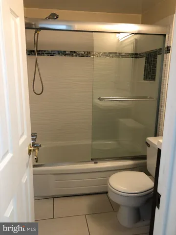 a bathroom with a toilet and shower