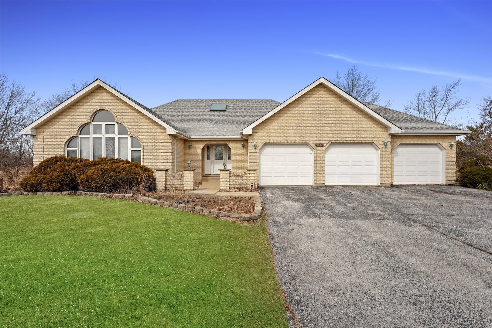 26554 South Winfield Road Monee, IL 60449 - Photo 1 of 31 a front view of a house with a yard and garage