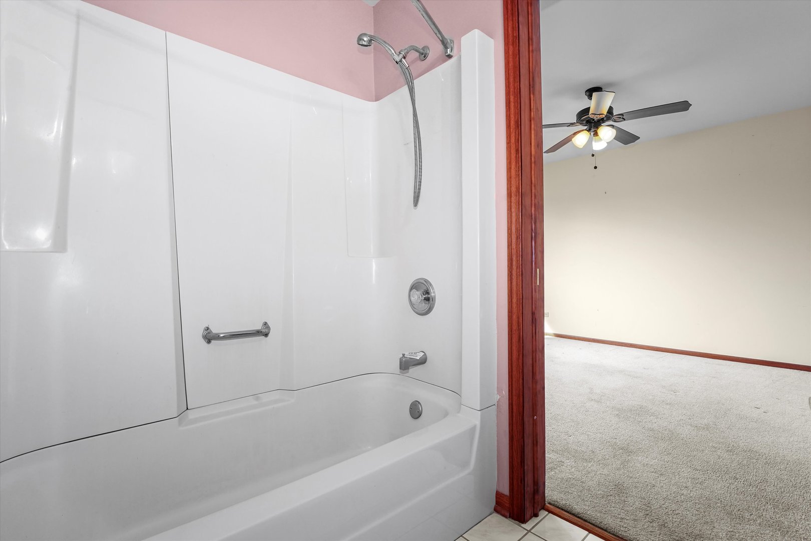 26554 South Winfield Road Monee, IL 60449 - Photo 18 of 31 a bathroom with a bathtub and shower