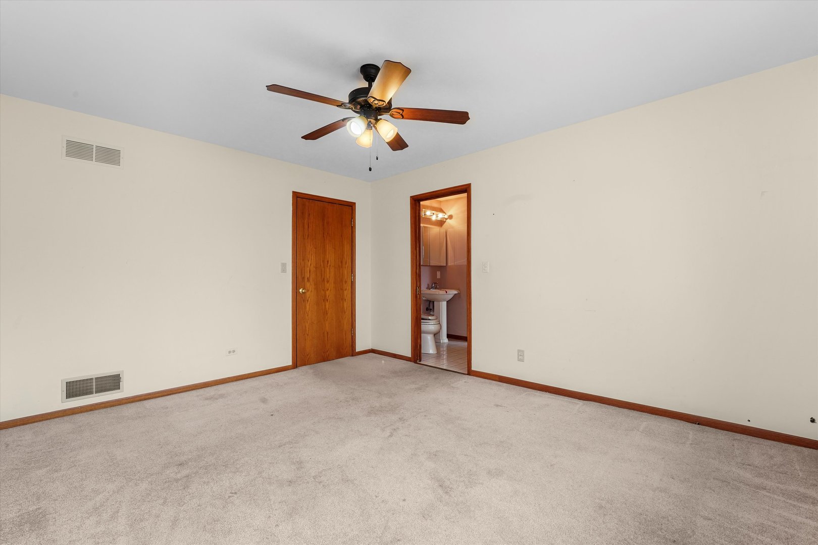26554 South Winfield Road Monee, IL 60449 - Photo 24 of 31 an empty room with closet and a chandelier fan