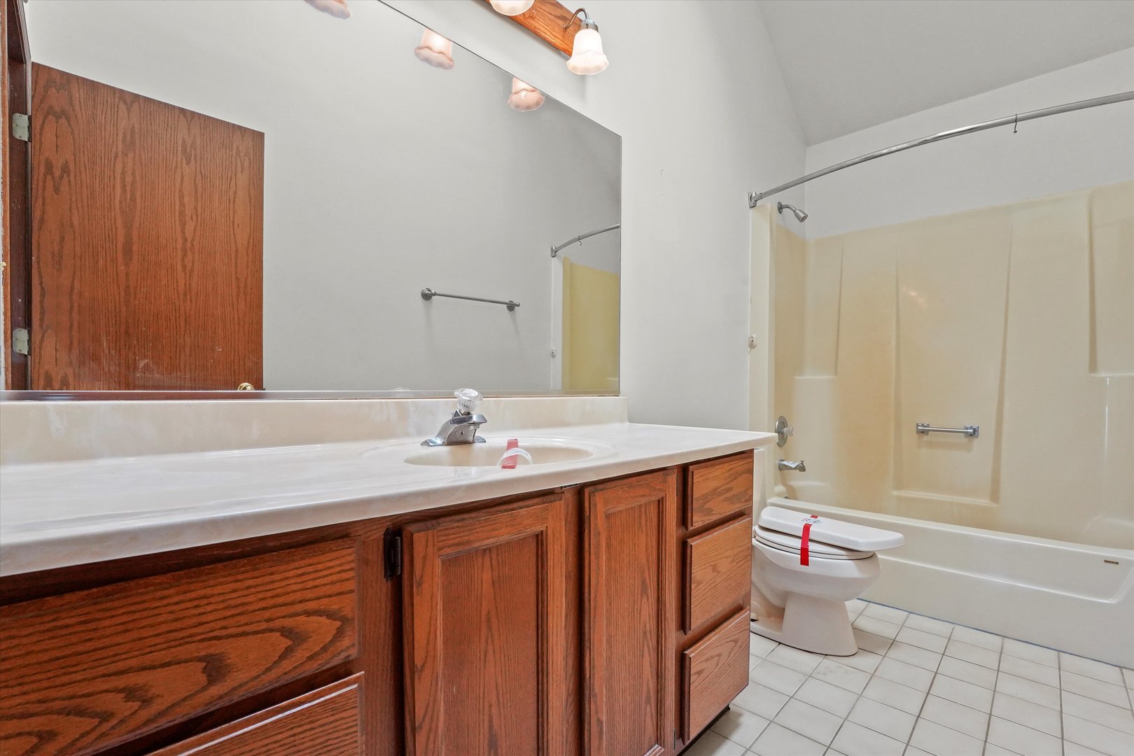 26554 South Winfield Road Monee, IL 60449 - Photo 25 of 31 a bathroom with a sink a toilet and shower