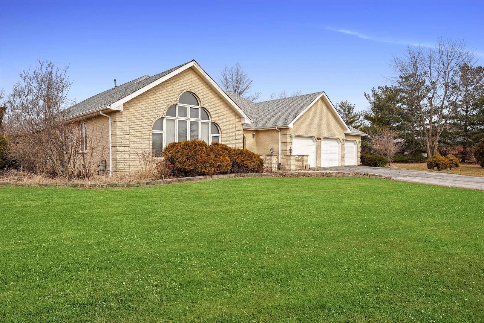 26554 South Winfield Road Monee, IL 60449 - Photo 3 of 31 a front of a house with a yard and trees