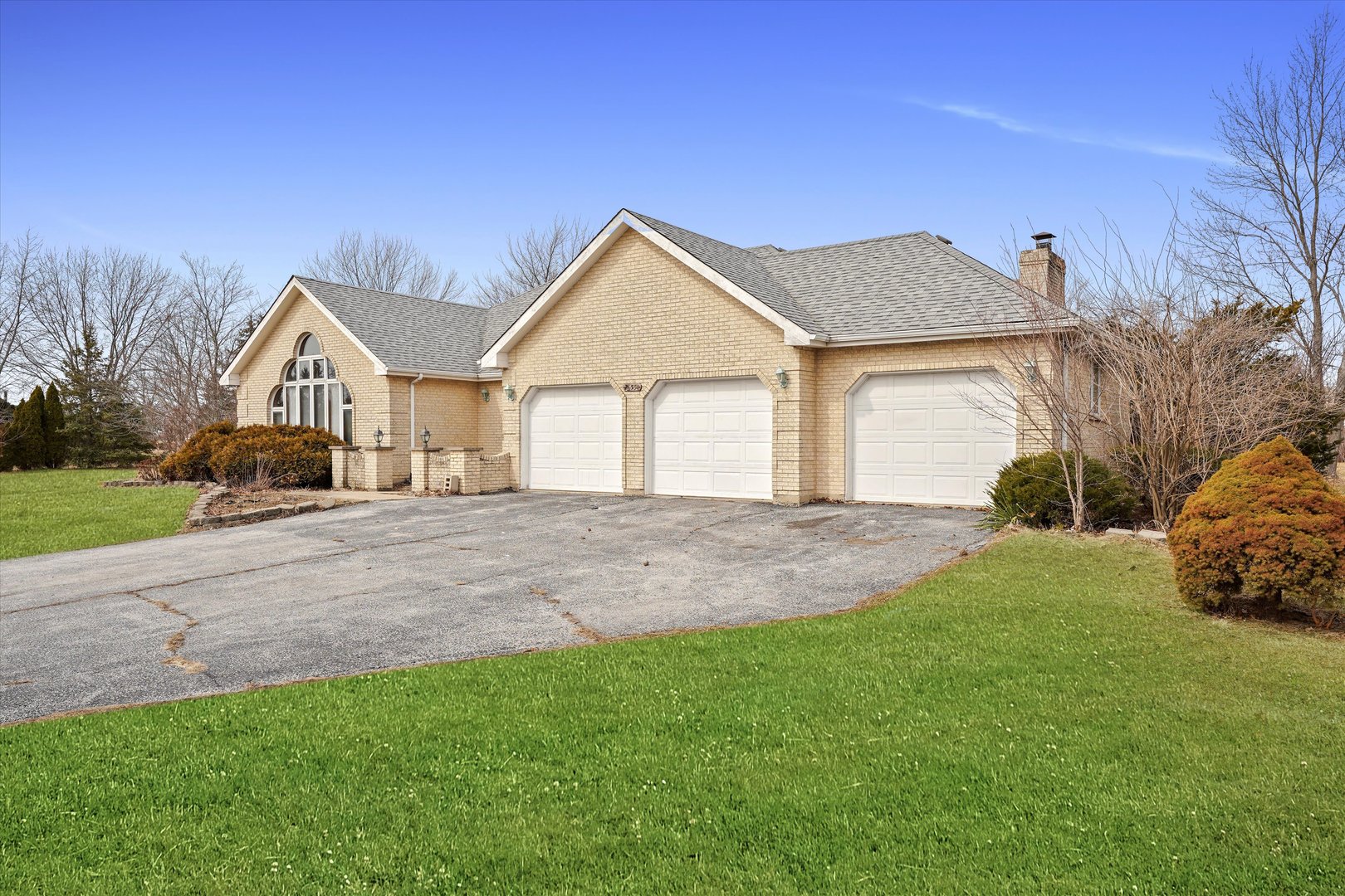 26554 South Winfield Road Monee, IL 60449 - Photo 4 of 31 a front view of a house with a yard and garage