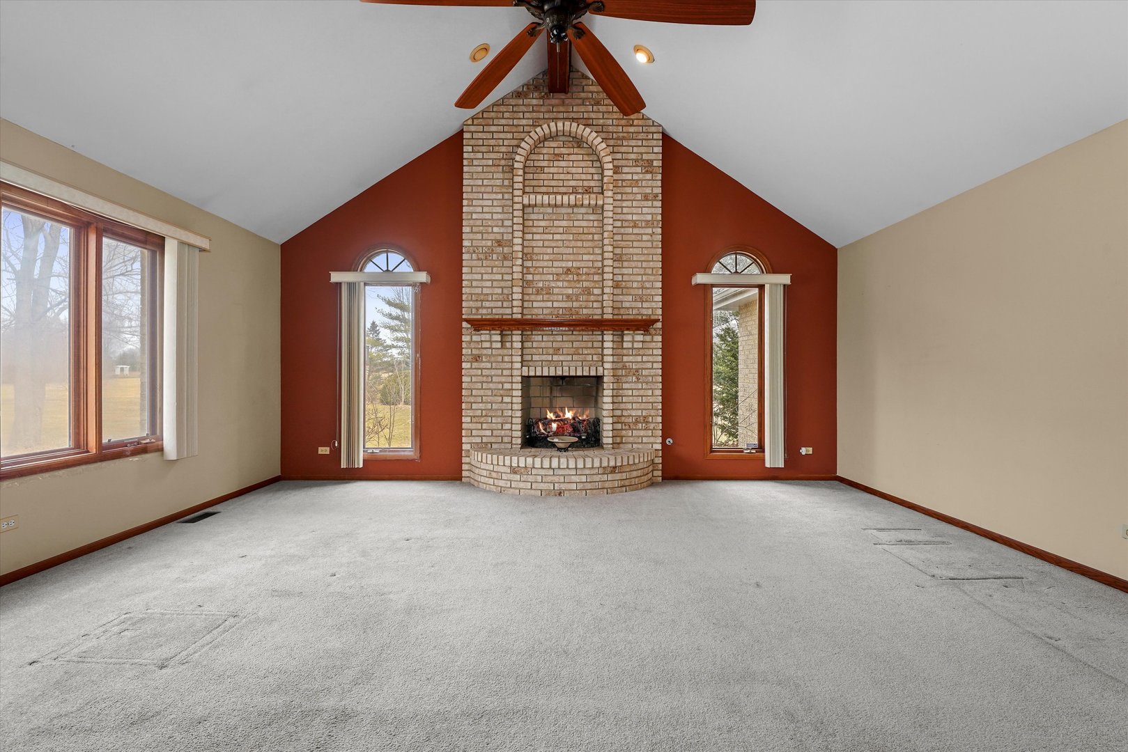 26554 South Winfield Road Monee, IL 60449 - Photo 8 of 31 an empty room with windows and fireplace